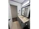 This bathroom features an extended vanity and a large mirror at 5526 Stoneleigh Ct, Stone Mountain, GA 30088