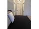 This cozy bedroom features a neutral color scheme and two closets at 5526 Stoneleigh Ct, Stone Mountain, GA 30088