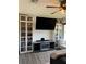 Bedroom featuring bookshelves, mounted television and fireplace at 5526 Stoneleigh Ct, Stone Mountain, GA 30088