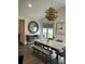 Dining space featuring an elegant chandelier, round mirror, and sleek furniture for refined meals at 5526 Stoneleigh Ct, Stone Mountain, GA 30088