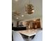 Dining area showcasing a marble table with elegant chandelier, open to the living room at 5526 Stoneleigh Ct, Stone Mountain, GA 30088