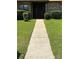 Well-maintained front yard and walkway lead to the welcoming front door of this lovely home at 5526 Stoneleigh Ct, Stone Mountain, GA 30088