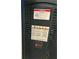 Close up of a furnace with a warning label at 5526 Stoneleigh Ct, Stone Mountain, GA 30088
