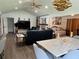Open living room featuring a sleek black leather sofa and modern decor at 5526 Stoneleigh Ct, Stone Mountain, GA 30088