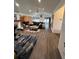 Expansive living area showcasing the open floor plan, hardwood floors, and a seamless transition between spaces at 5526 Stoneleigh Ct, Stone Mountain, GA 30088