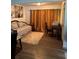 Versatile living space with elegant gold curtains, and classic furniture, can be used as a bedroom or office at 5526 Stoneleigh Ct, Stone Mountain, GA 30088