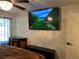 Primary bedroom featuring dark dresser and large flat screen television at 5526 Stoneleigh Ct, Stone Mountain, GA 30088