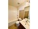 Bathroom featuring a bathtub-shower combo, toilet, and vanity with sink at 665 Roxford Ln, Buford, GA 30518