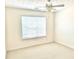 Bedroom featuring neutral carpet, ceiling fan, and window with blinds for natural light at 665 Roxford Ln, Buford, GA 30518