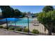 Inviting community pool surrounded by lush greenery, lounge chairs, and shaded areas at 665 Roxford Ln, Buford, GA 30518
