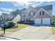 Charming brick home with two-car garage and well-maintained landscaping at 665 Roxford Ln, Buford, GA 30518