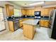 Well-equipped kitchen with stainless steel appliances and island counter at 665 Roxford Ln, Buford, GA 30518