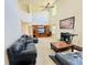 Expansive living room featuring a fireplace, media center, and ample seating at 665 Roxford Ln, Buford, GA 30518