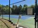Community tennis court with posted rules for the Roxwood Park neighborhood at 665 Roxford Ln, Buford, GA 30518