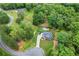 Aerial view of a stunning home with a pool and meticulously landscaped yard at 1301 Ficklen Church Way, Canton, GA 30114