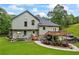 View of the backyard featuring a wooden deck, patio, boat, and landscaping at 1301 Ficklen Church Way, Canton, GA 30114