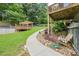 Enjoy this backyard with a wooden deck, a beautiful garden, and a well-maintained lawn at 1301 Ficklen Church Way, Canton, GA 30114