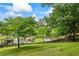 Expansive backyard with an in-ground pool, wooden pergola, and mature trees, perfect for entertaining at 1301 Ficklen Church Way, Canton, GA 30114