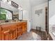 Bathroom vanity featuring a granite-top and access to a large soaking tub and shower at 1301 Ficklen Church Way, Canton, GA 30114