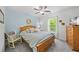 Cozy bedroom with a wooden bed frame, blue accent wall, and ample natural light at 1301 Ficklen Church Way, Canton, GA 30114
