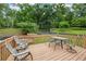 Enjoy outdoor living on this charming deck, perfect for dining or relaxing with scenic views of the lush backyard at 1301 Ficklen Church Way, Canton, GA 30114