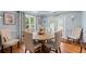 Cozy dining room featuring a rustic round table, comfortable upholstered chairs, and natural light at 1301 Ficklen Church Way, Canton, GA 30114