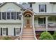Inviting front entryway with warm lighting, stylish door, and a charming front porch, perfect for greeting guests and creating a welcoming ambiance at 1301 Ficklen Church Way, Canton, GA 30114