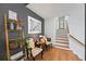 Inviting entryway featuring hardwood floors, stylish decor, and a staircase leading to the upper level at 1301 Ficklen Church Way, Canton, GA 30114