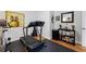 Exercise room with hardwood floors, treadmill, storage, and ample natural light at 1301 Ficklen Church Way, Canton, GA 30114