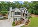 Picturesque two-story home with a three-car garage, complete with a refreshing pool, and a charming front porch for relaxing outdoors at 1301 Ficklen Church Way, Canton, GA 30114