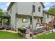Charming backyard patio with outdoor seating, string lights, and lush greenery for outdoor entertaining and relaxation at 1301 Ficklen Church Way, Canton, GA 30114