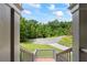 Exterior view from stairs looking at treelined road and neighborhood at 1301 Ficklen Church Way, Canton, GA 30114