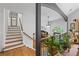 Bright foyer with wooden staircase, hardwood floors, and elegant decor at 1301 Ficklen Church Way, Canton, GA 30114