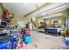 Spacious garage with overhead storage, a refrigerator, and ample room for vehicles and other items at 1301 Ficklen Church Way, Canton, GA 30114