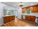 Beautiful kitchen with wood cabinetry, white countertops, and access to the dining area and backyard at 1301 Ficklen Church Way, Canton, GA 30114