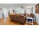 Spacious living room with hardwood floors, leather furniture, and a ceiling fan at 1301 Ficklen Church Way, Canton, GA 30114