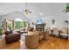 Spacious living room featuring hardwood floors, stone fireplace, vaulted ceilings, and ample natural light at 1301 Ficklen Church Way, Canton, GA 30114