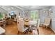 Open-concept living room and dining area featuring hardwood floors and ample natural light at 1301 Ficklen Church Way, Canton, GA 30114