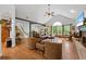Bright living room with vaulted ceiling, hardwood floors, stone fireplace, and views of the backyard at 1301 Ficklen Church Way, Canton, GA 30114