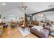 Open-concept living room with hardwood floors, vaulted ceiling, and comfortable seating arrangements at 1301 Ficklen Church Way, Canton, GA 30114