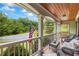 Relaxing front porch with cozy seating and scenic views, perfect for enjoying the outdoors and creating a peaceful retreat at 1301 Ficklen Church Way, Canton, GA 30114