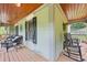Spacious porch area featuring comfortable seating, wooden ceiling, and decorative shutters at 1301 Ficklen Church Way, Canton, GA 30114