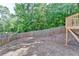 Fenced backyard space offers a fire pit and lots of green space with mature trees at 3805 Roxwood Park Dr, Buford, GA 30518