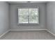 Bedroom with neutral walls, carpet, and window with wood blinds at 3805 Roxwood Park Dr, Buford, GA 30518