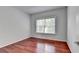 Simple bedroom with hardwood floors and a window at 3805 Roxwood Park Dr, Buford, GA 30518
