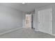 Neutral bedroom with plush carpet, a doorway, and a closet with double doors at 3805 Roxwood Park Dr, Buford, GA 30518