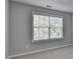 Bedroom with neutral walls, carpet, and window with wood blinds at 3805 Roxwood Park Dr, Buford, GA 30518