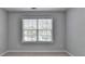 Bedroom with neutral walls, carpet, and window with wood blinds at 3805 Roxwood Park Dr, Buford, GA 30518