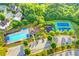 An aerial view of community amenities, including a pool, tennis courts, and playground at 3805 Roxwood Park Dr, Buford, GA 30518