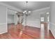 Dining room with hardwood floors and an open layout at 3805 Roxwood Park Dr, Buford, GA 30518